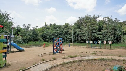 Fototapeta na wymiar Bangalore,Karnataka,India-October 04 2022: Colorful Kids playing equipment in Agara Lake park.