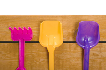 Summer plastic toys for sand on a wooden deck