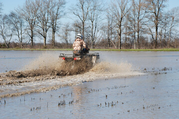 Obraz na płótnie Canvas Fun in the mud with an ATV 