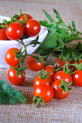 Cherry tomatoes, Bunch of fresh, red tomatoes with green stems, Selective focus.