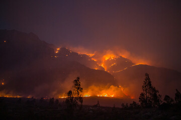 Fire Burning Across Mountainside