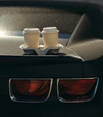 cups of coffee on black sport car Chevrolet Camaro