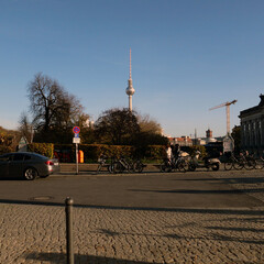 sunny berlin tv tower and cyclists