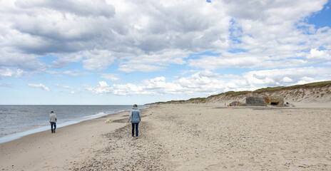 Fototapeta na wymiar Waking on Sandy beach by Husby town. Populated place, Holstebro, Region Midtjylland, Denmark, Scandinavia, Europe