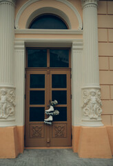 white rollers skates with flowers on house door