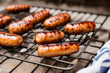 Barbecue with burning sausages on the grill