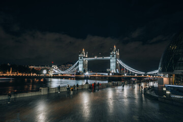 London Bridge over Thames in London by night with light trails long exposure