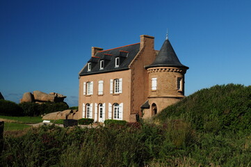 Fototapeta na wymiar Historic Gustave Eiffel House On The Beautiful Red Rock Coast In Ploumanach In Bretagne France On A Beautiful Sunny Summer Day With A Clear Blue Sky