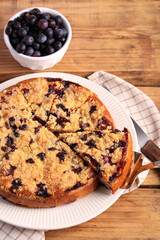 cake with berries and crumble topping