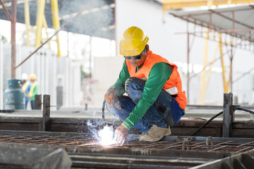 Welder welding worker working in the construction site. Asian welder welding workers at work