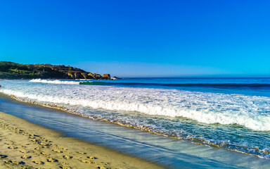 Extremely huge big surfer waves beach La Punta Zicatela Mexico.