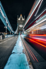 Fototapeta na wymiar London Bridge over Thames in London by night with light trails long exposure