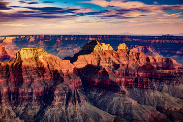 Fototapeta na wymiar Sunset on bluffs of the Grand Canyon from the North Rim in Arizona