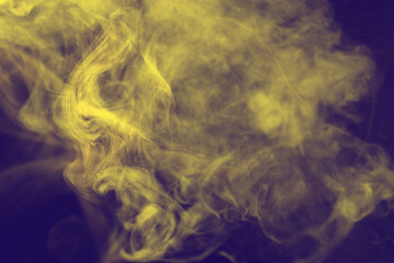 Yellow steam on a black background.