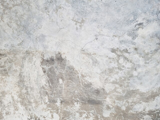 grey concrete wall - exposed concrete used as background with blank space for design. raw rustic cement background. cracked and weathered surrounding wall.