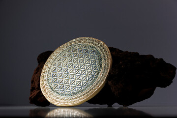 fired clay disk with circles with real shadows