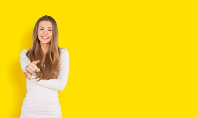 Happy young smart woman posing on background