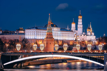 View from the Patriarchal Bridge to the Moscow Kremlin. Vodovzvodnaya tower of the Kremlin and the Big Stone Bridge. The attraction of the city. Night city. New Year decorations.