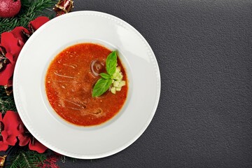 Tasty fresh hot dish with a Christmas branch
