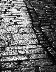 cobblestone street at night in backlight,