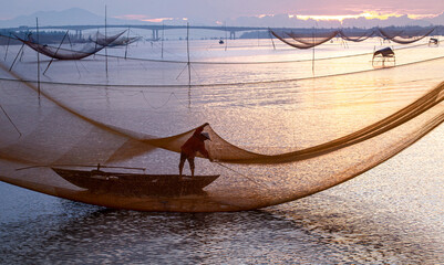 Catch fish in the river at dawn