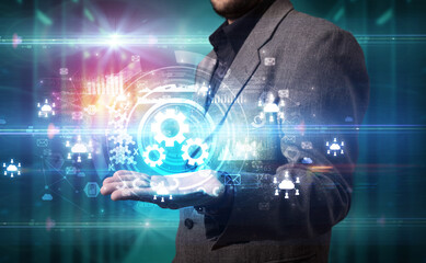 Businessman holding technology icon concept