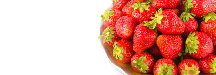 Ripe strawberries isolated on a white background. Wide photo. Free space for text.