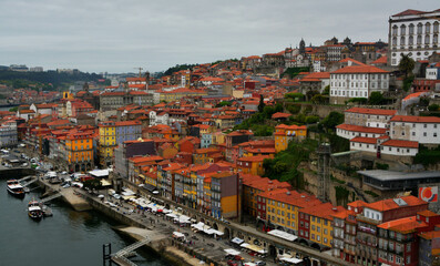 Fototapeta na wymiar Panoramic view on Porto town with colorful buildings and red roofs. 