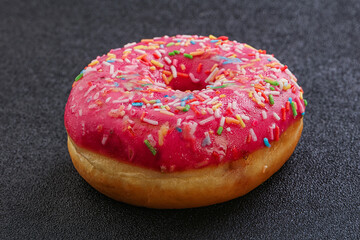 Sweet glazed struwberry donut with icing