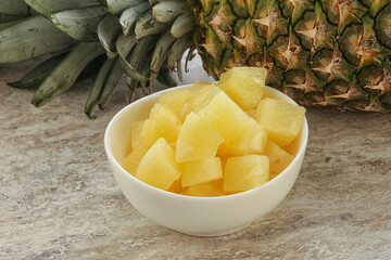 Marinated pineapple slices in the bowl