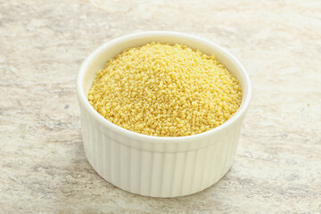 Raw couscous in the bowl