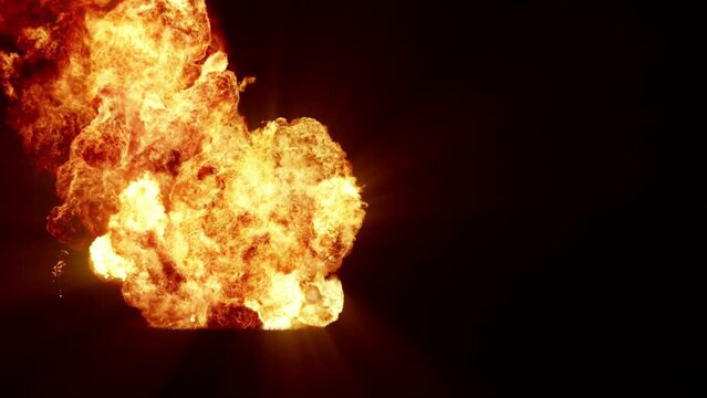 Series of spectacular explosions isolated on a black background. A dynamic composition of subsequent detonating bright colorful explosions, shock waves and puffs of smoke filling the space
