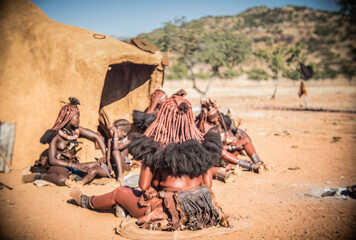 himba people in the village in namibia - obrazy, fototapety, plakaty