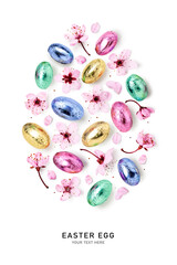 Easter egg. Colorful candies and cherry pink flowers isolated on white.