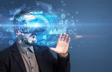 Businessman looking through VR glasses