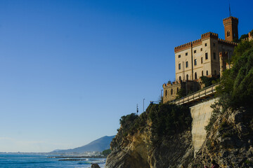 Ancient medieval castle fort on a mountain against the blue sky in Europe