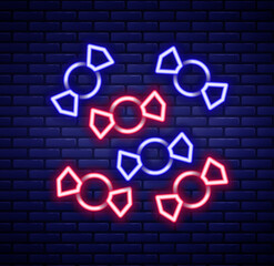 Glowing neon line Candy icon isolated on brick wall background. Merry Christmas and Happy New Year. Colorful outline concept. Vector