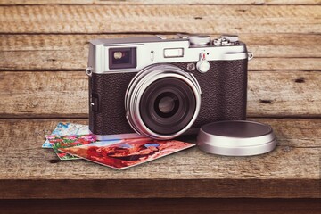 Retro old camera on wooden desk.