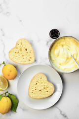 Heart lemon cake in preparation. White background and copy space