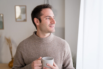 Thoughtful man with cup of coffee