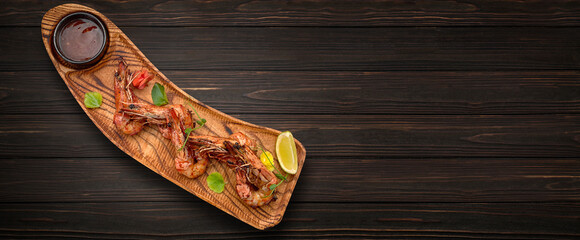 Grilled king prawns with barbecue sauce and lime