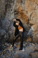 Model standing near the rock. Mika Nakano