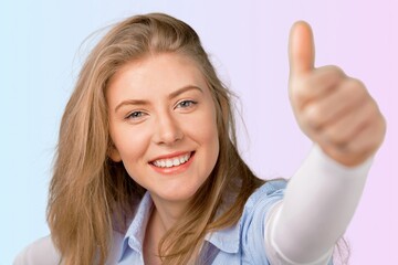 Beautiful young woman show thumb up