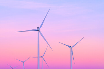 Fototapeta premium Renewable energy sources. Wind turbines on the shore. Netherlands. Bright sky during sunset. Wallpaper and background. Industrial image.