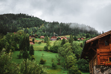 Wooden hut in the alps with mountains in the background Panorama