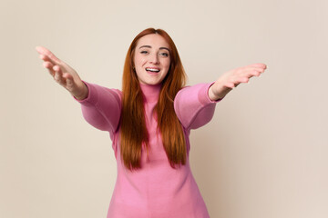 Young red hair woman isolated feels confident giving a hug to the camera.