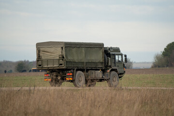 Fototapeta premium British army MAN SV 4x4 logistics lorry moving along a country track