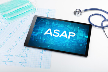 Close-up view of a tablet pc with medical abbreviation