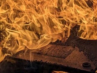Charred Surface Flames Of Fire Background