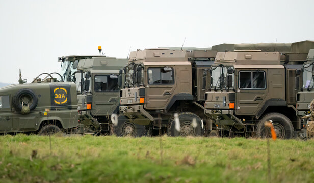 Salisbury, Wiltshire UK - February 5 2023: Soldiers preparing army vehicles for a military exercise
